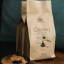 Package of Aro Ha Ceremonial Cacao with a beautiful spice mix, featuring a brown paper bag with a graphic design.